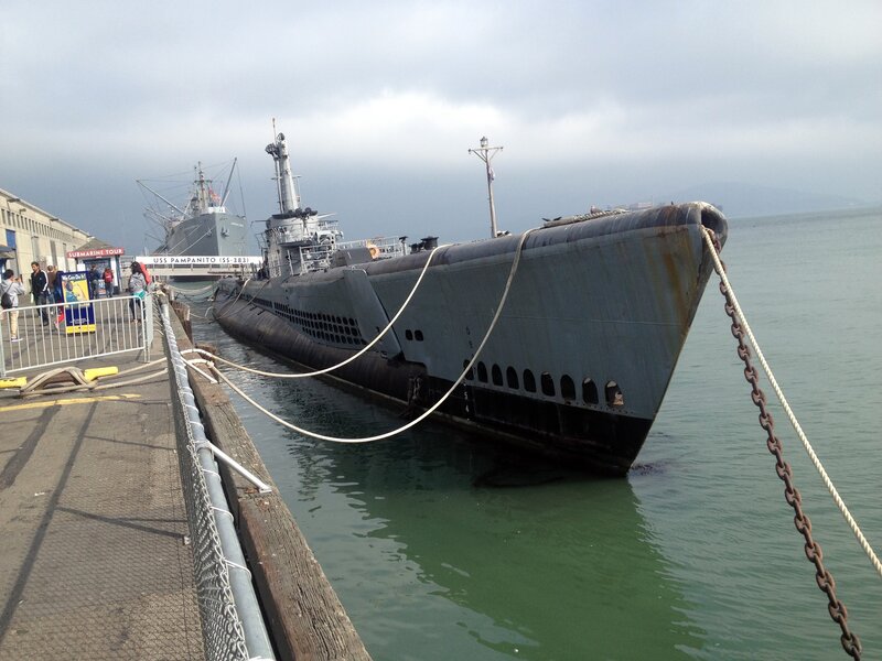 Submarine docked at pier