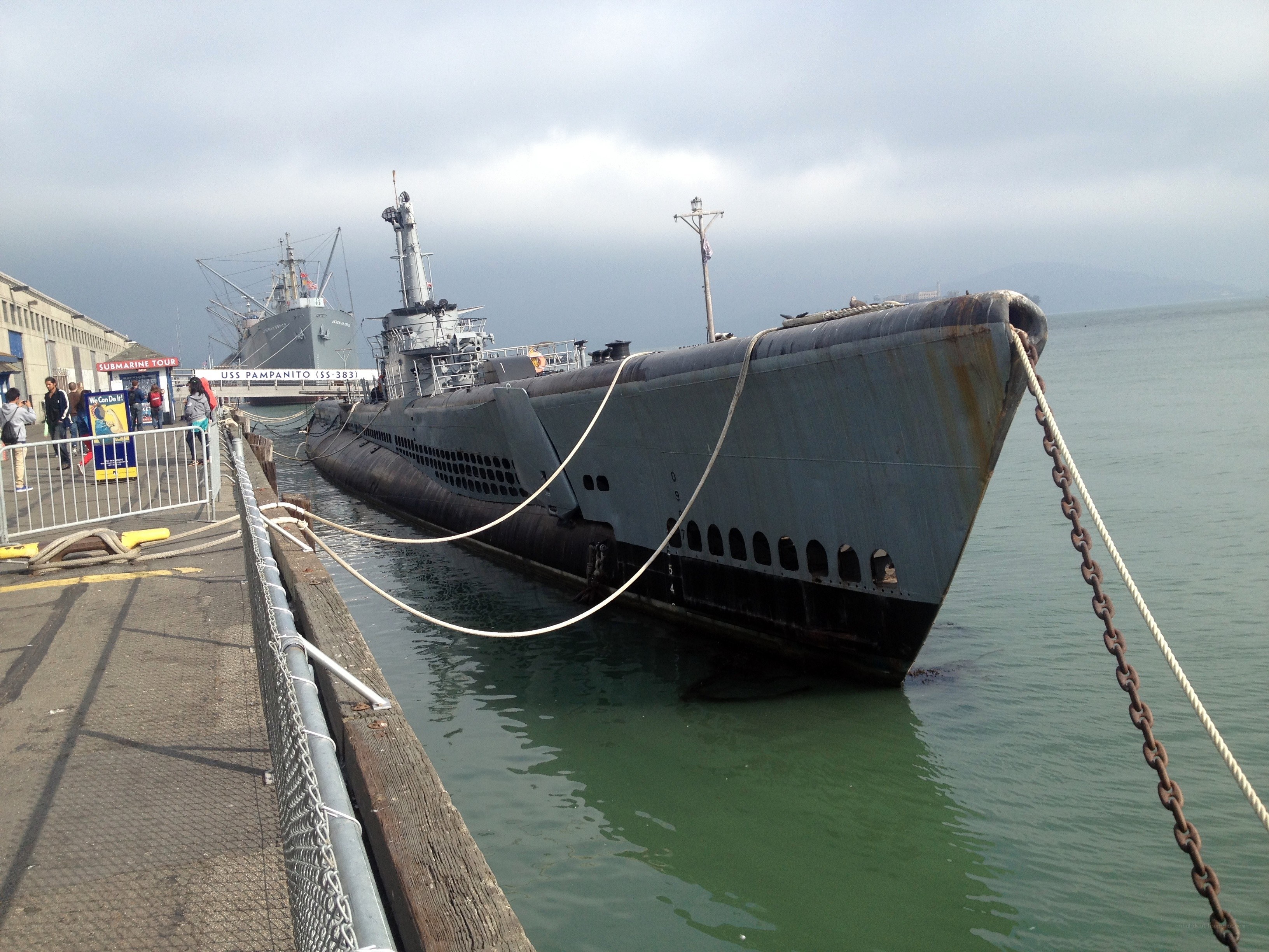Submarine docked at pier