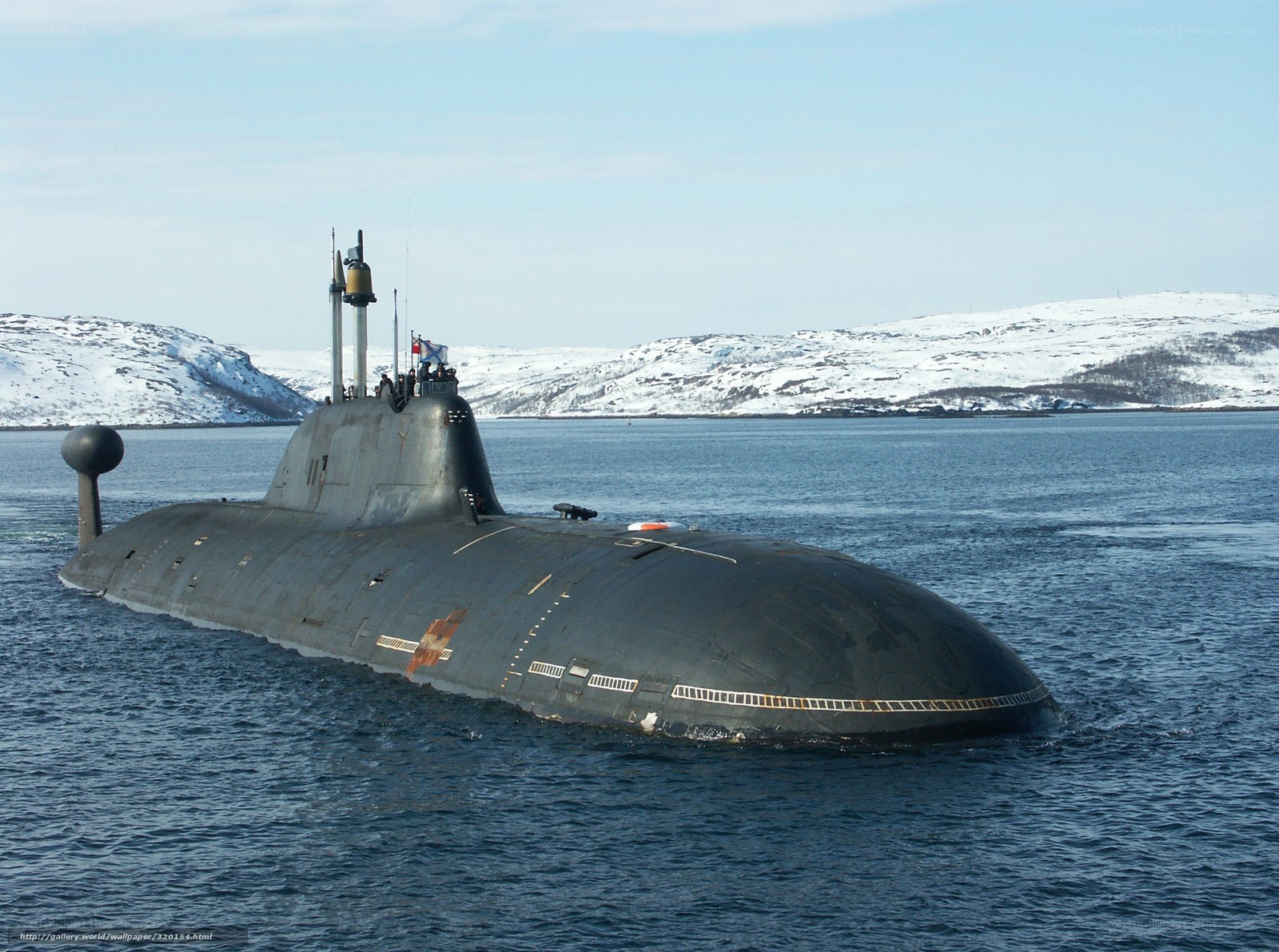 Submarine in a snowy harbor