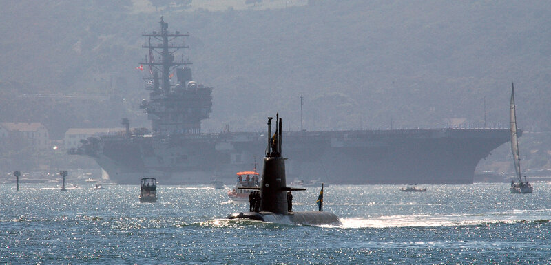 Submarine near aircraft carrier