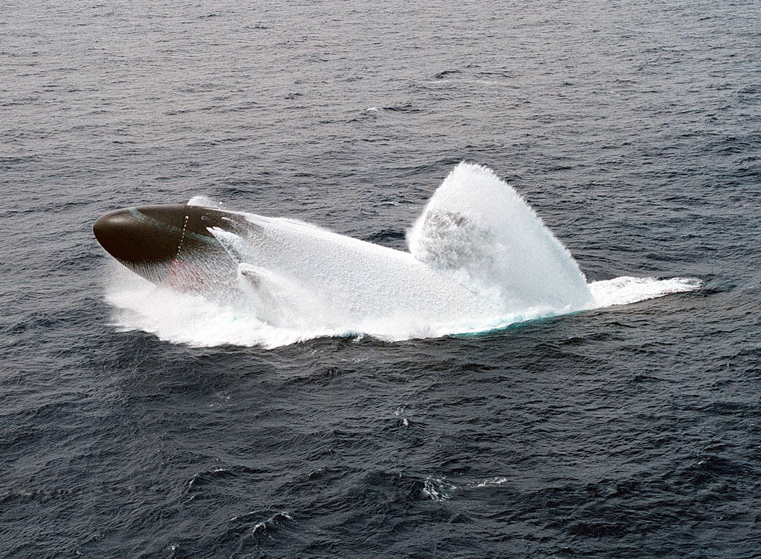 Submarine surfacing in ocean