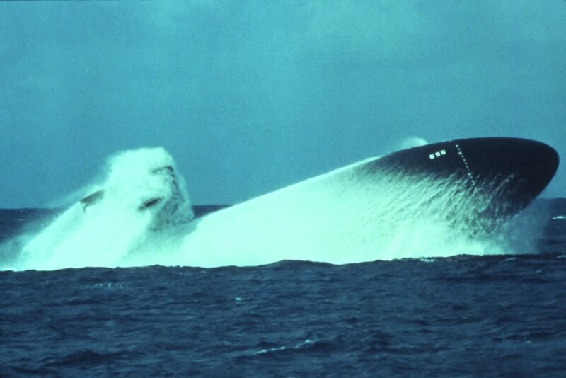 Submarine surfacing in ocean