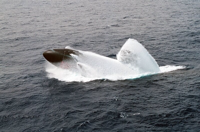 Submarine surfacing in ocean