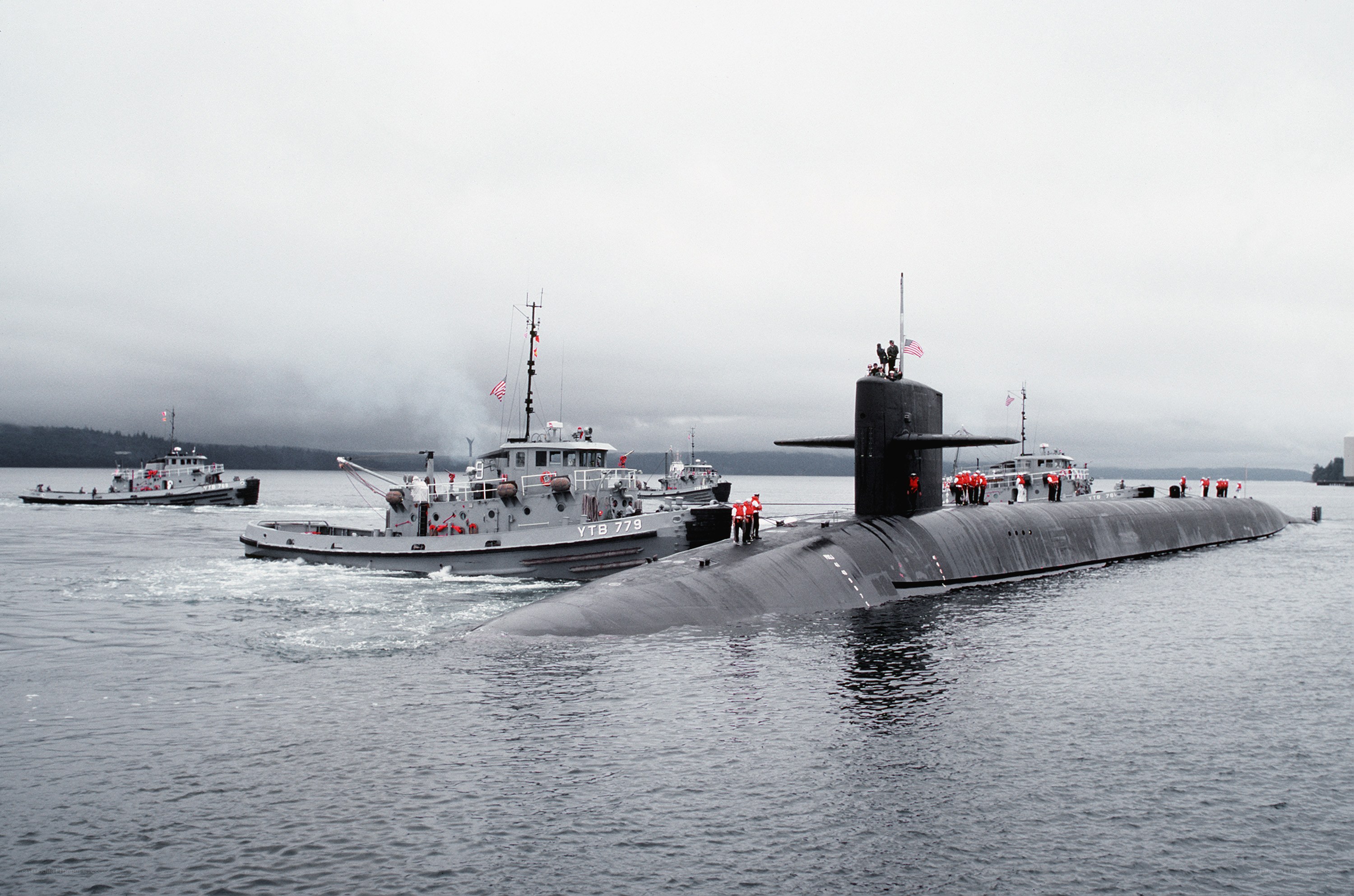 Submarine with tugboats