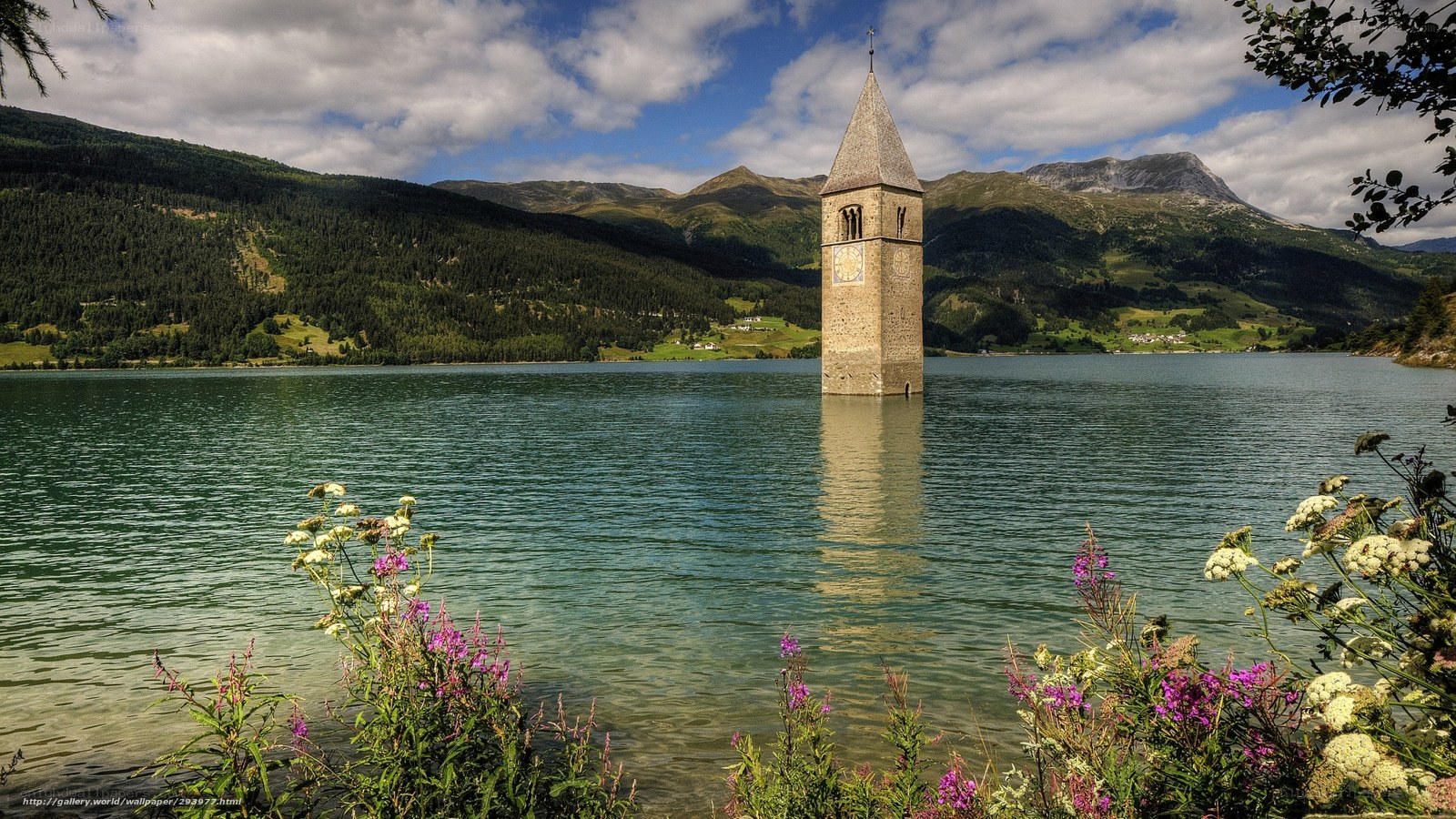 Submerged church tower in lake