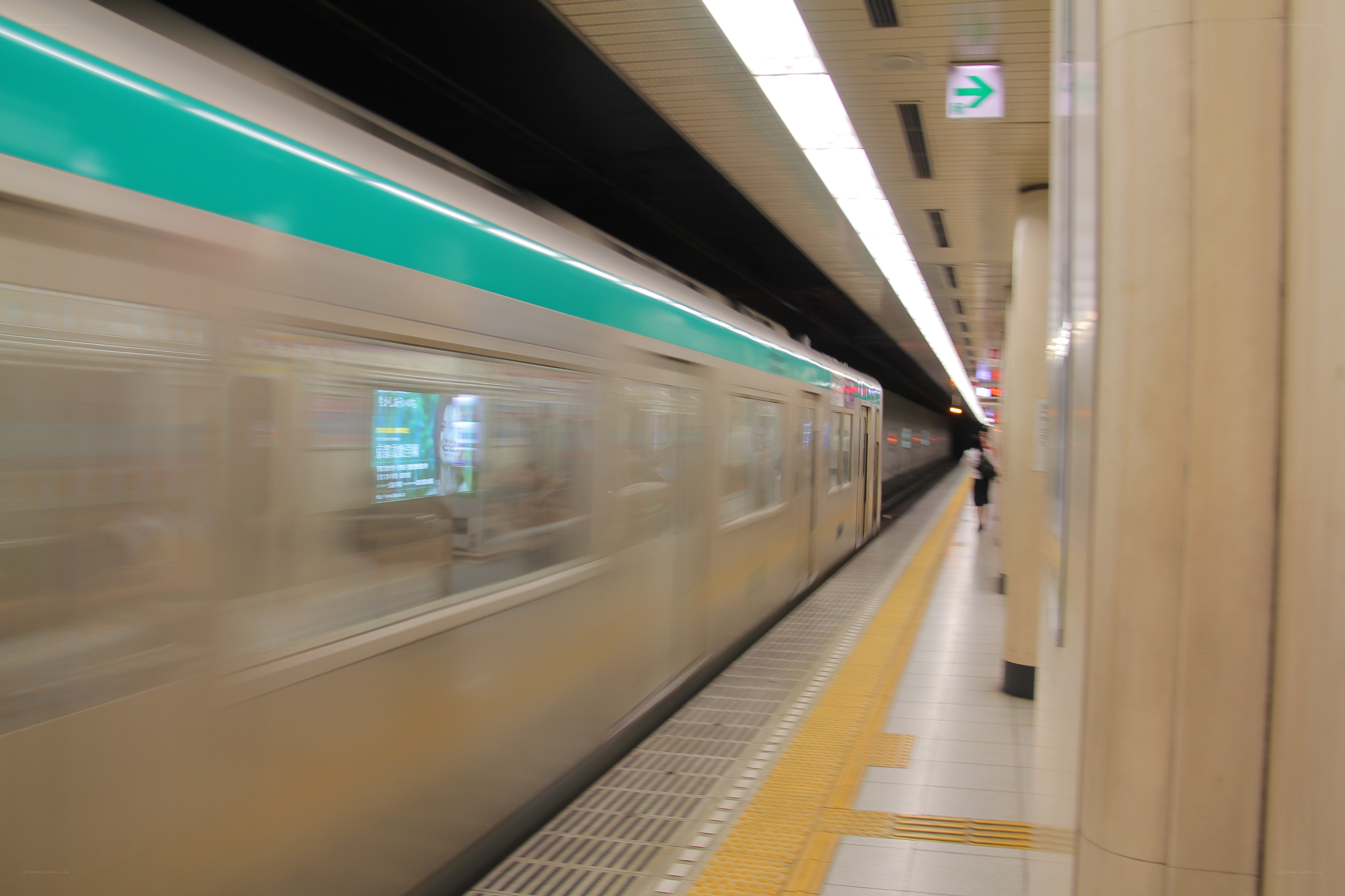 Subway train in motion at station