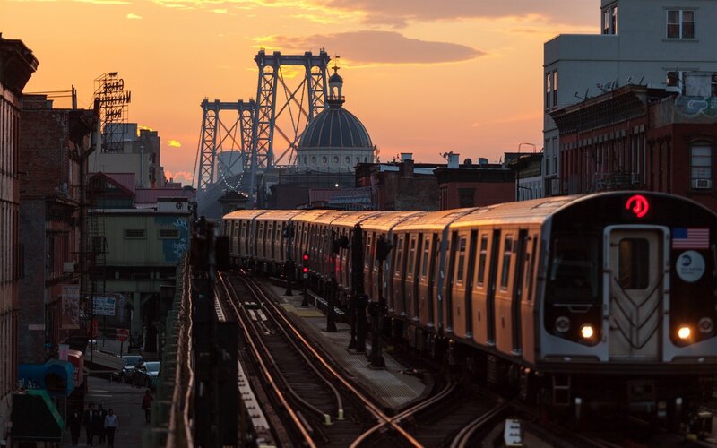 Subway Train on Tracks — Orange