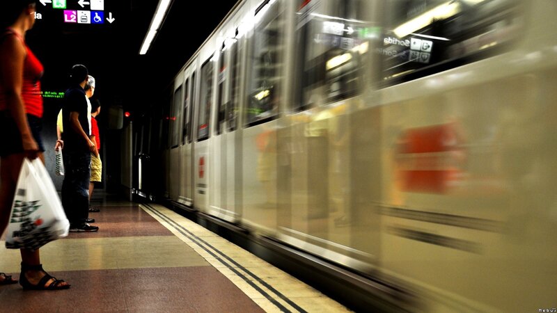 Subway train passing station