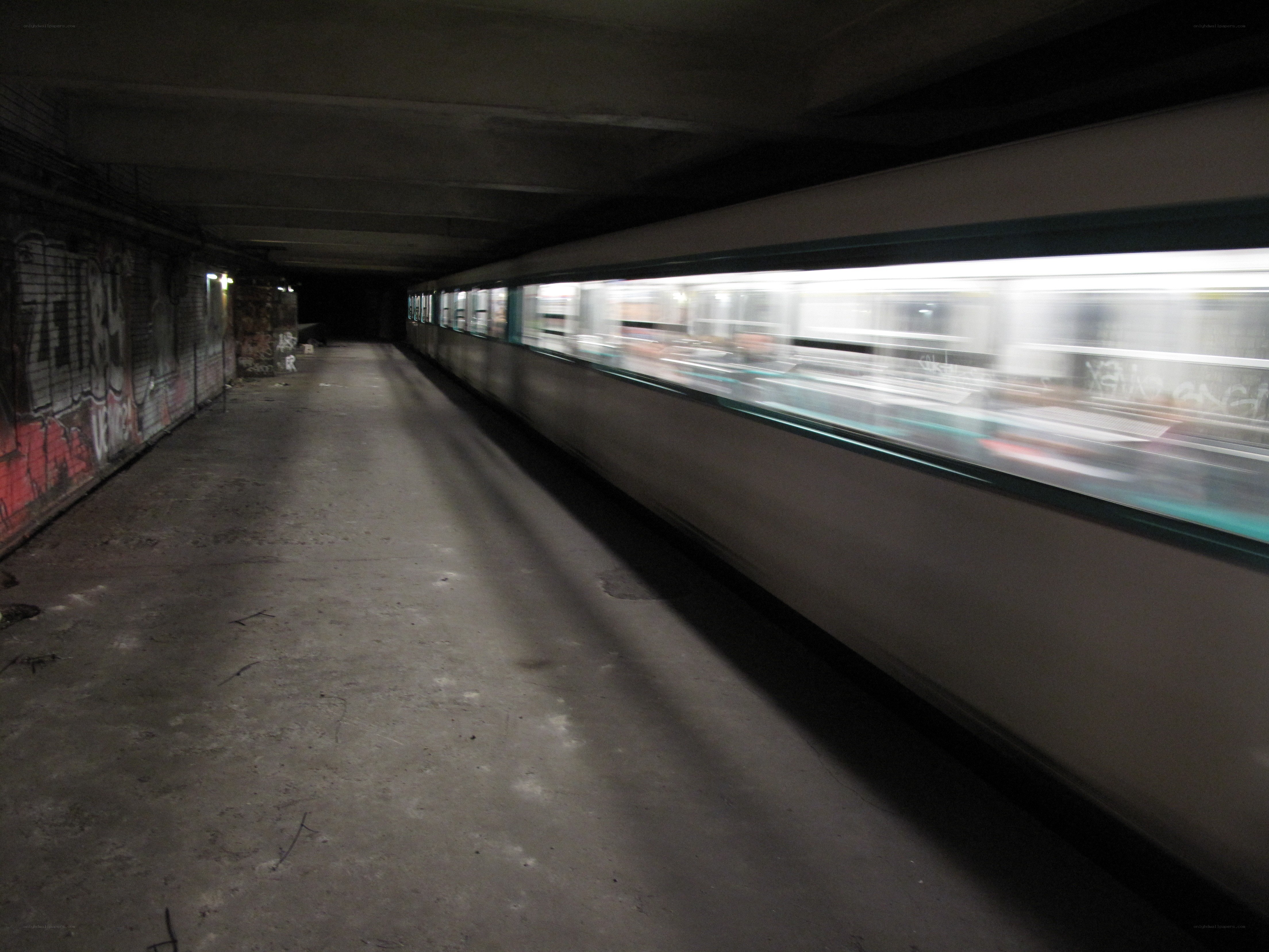 Subway train passing through station