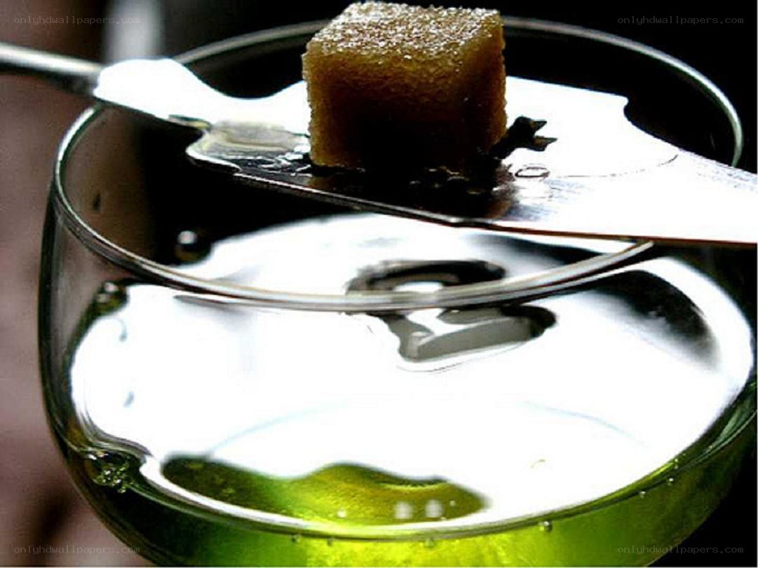 sugar cube on spoon over drink