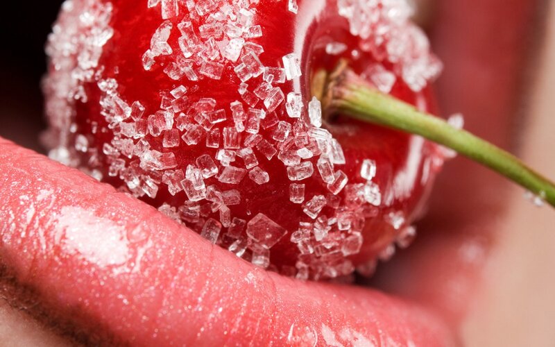 sugared cherry in hand