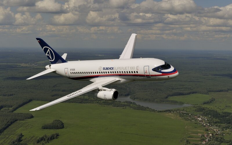 Sukhoi Superjet 100 — White, Serene, Afternoon