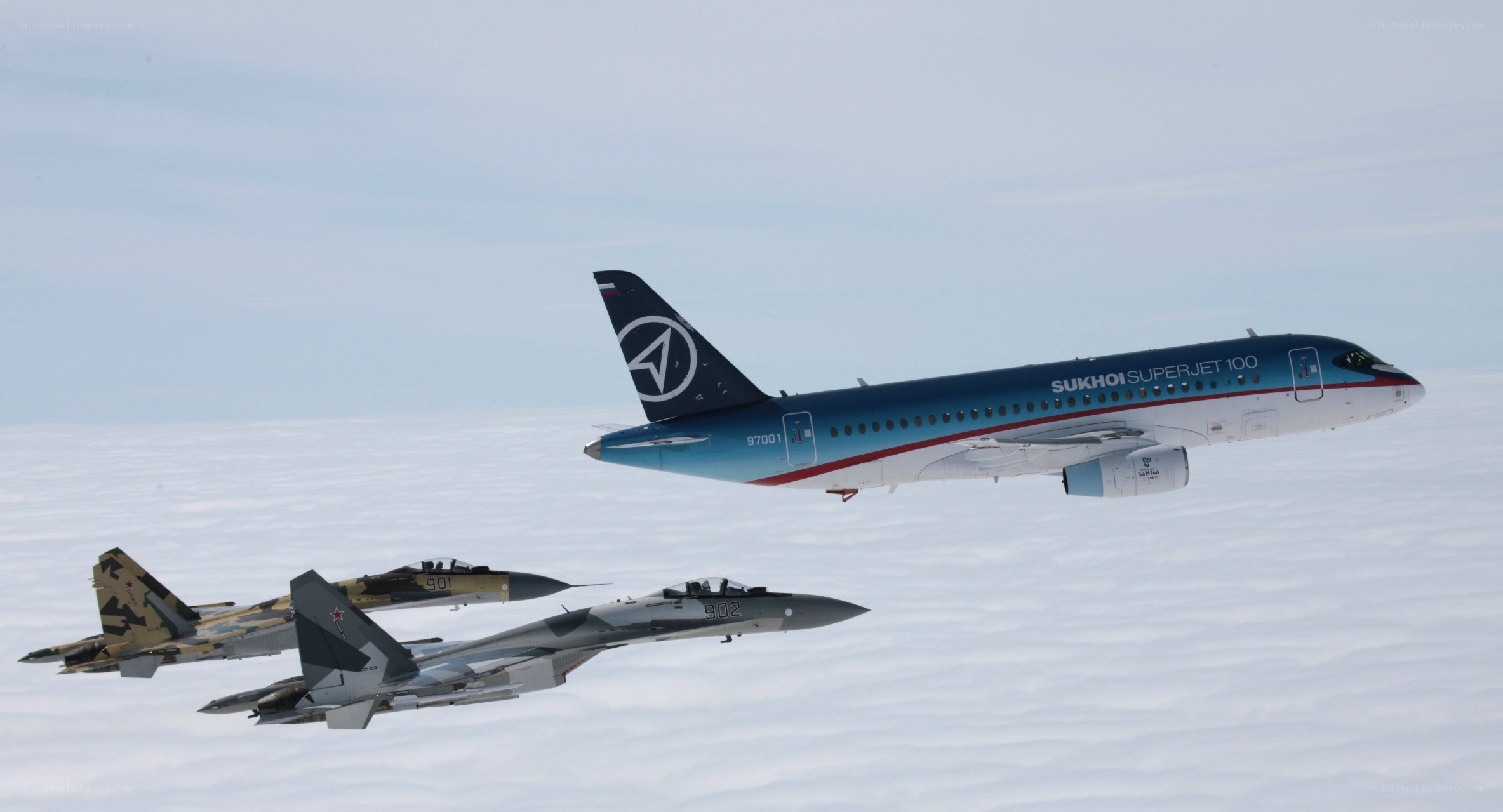 Sukhoi Superjet escorted by fighters