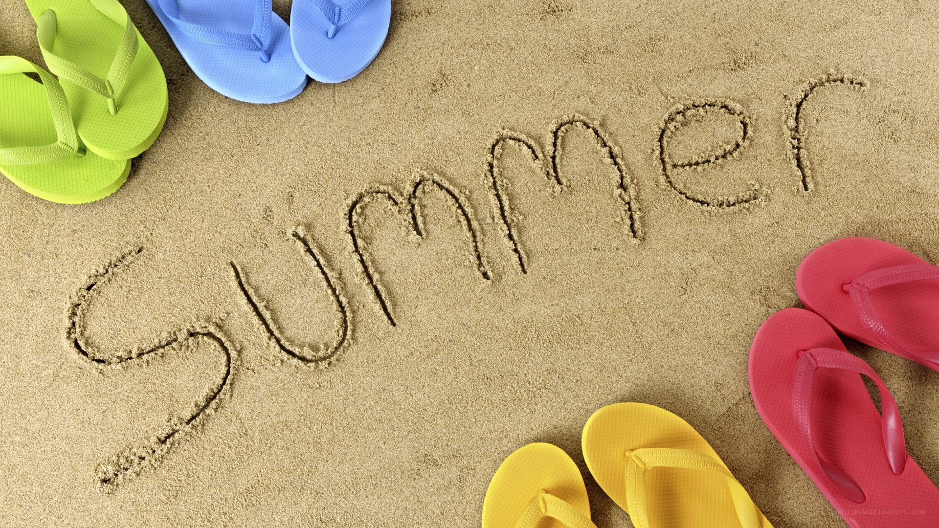Summer written in the sand