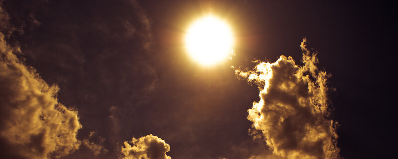 Sun behind clouds