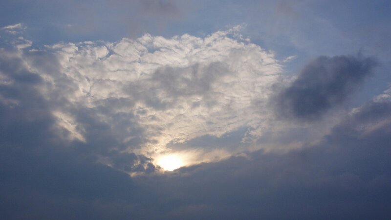 Sun Behind Clouds — Blue, Sunset