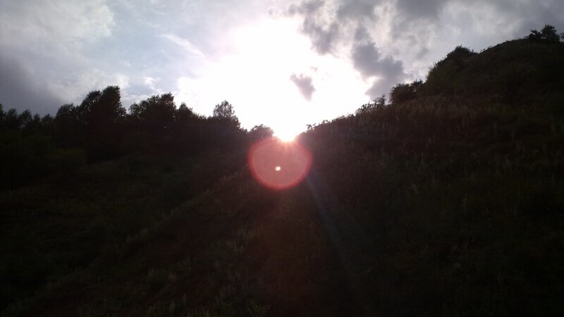 Sun Behind Hills — Black