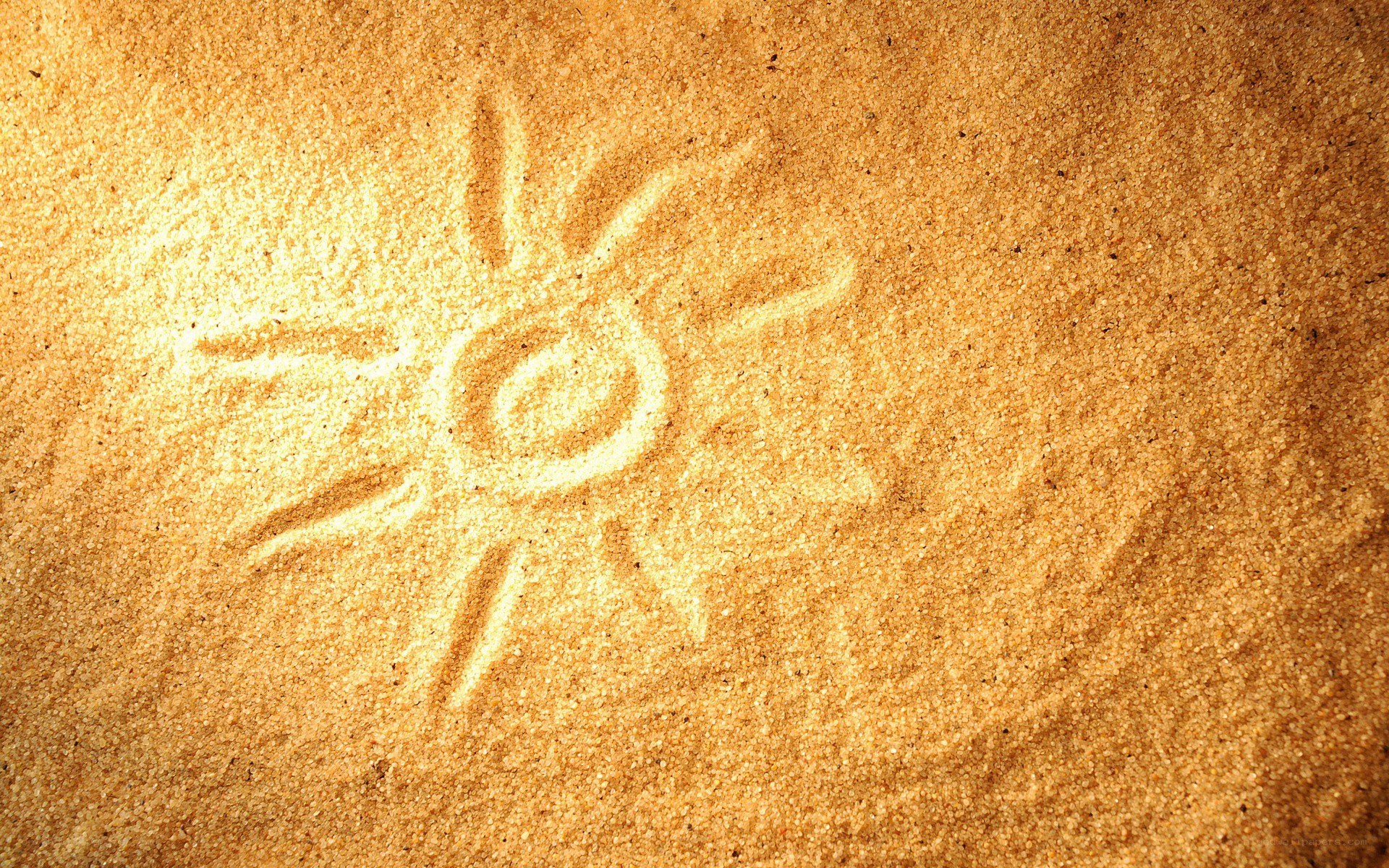 Sun drawn in the sand