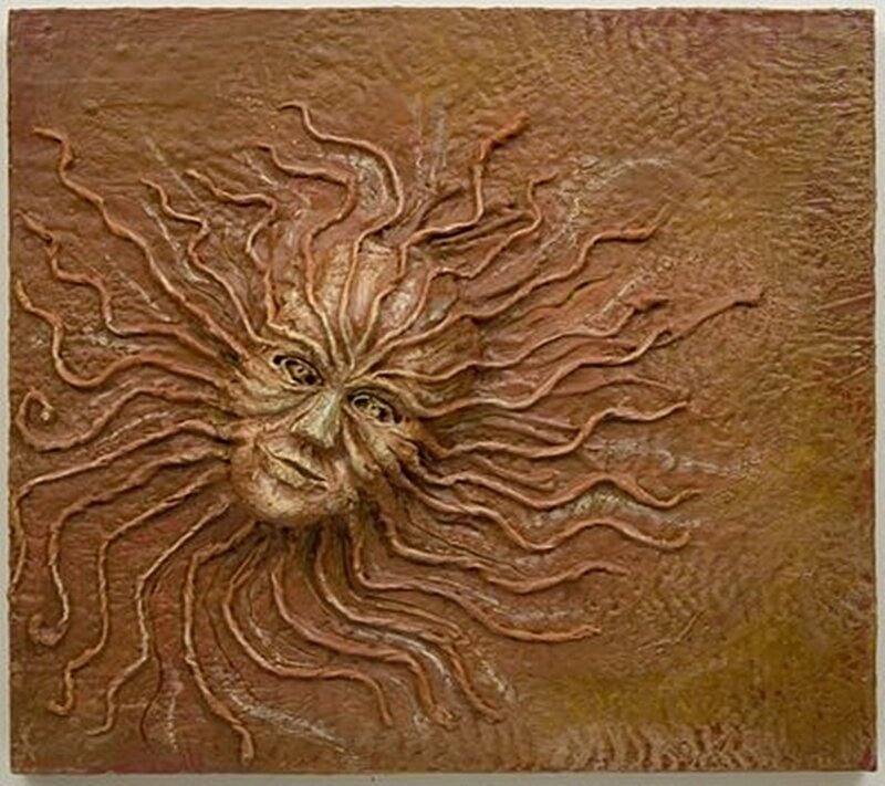 Sun face sculpture