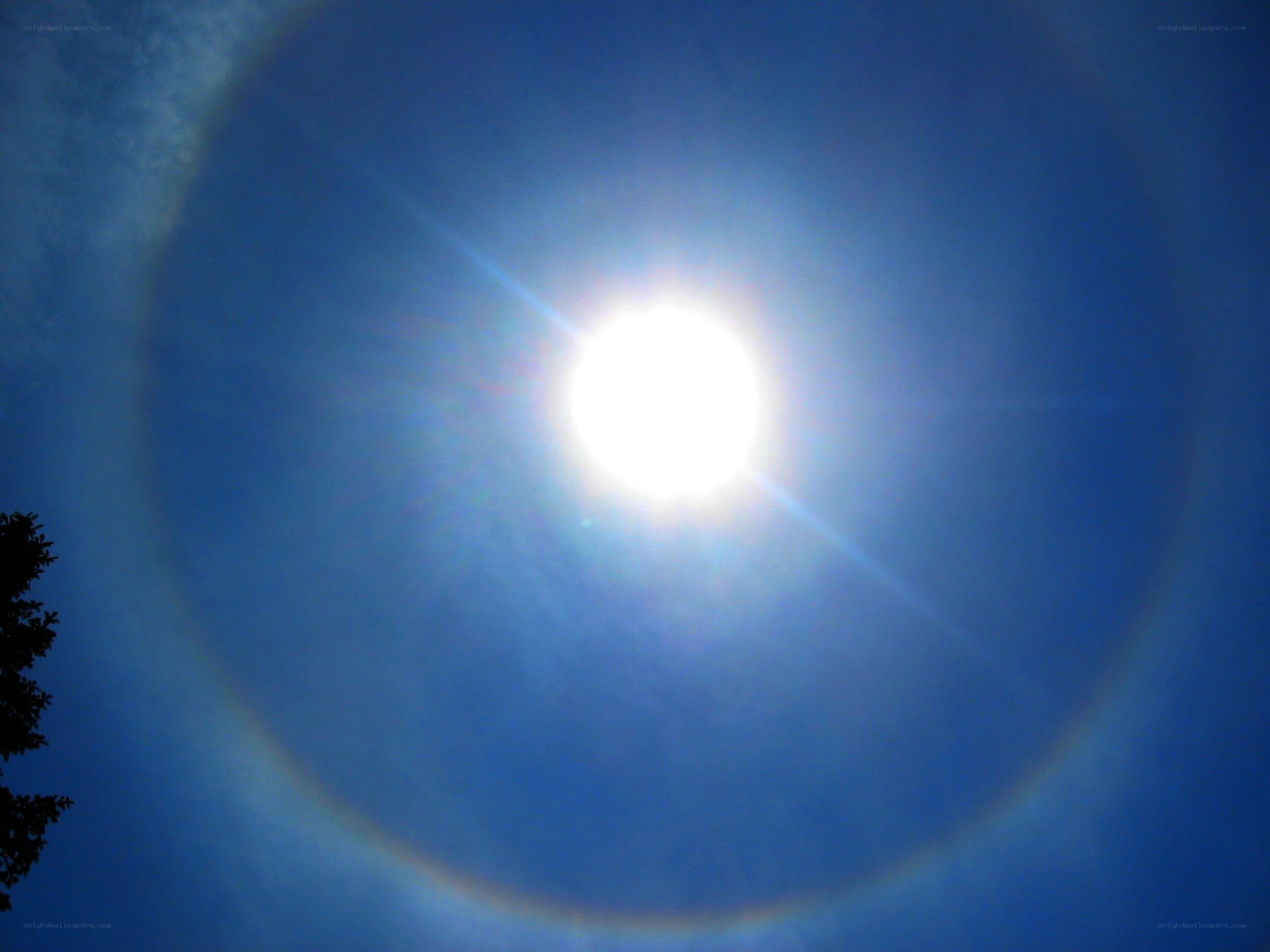 Sun halo in blue sky