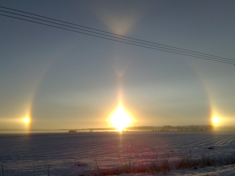 Sun halo over snowy field