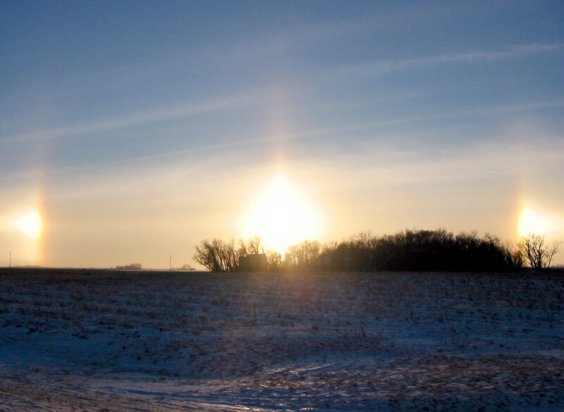 Sun halo over snowy field