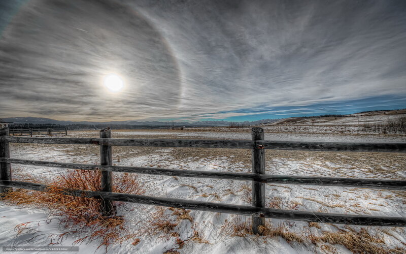 Sun halo over snowy field