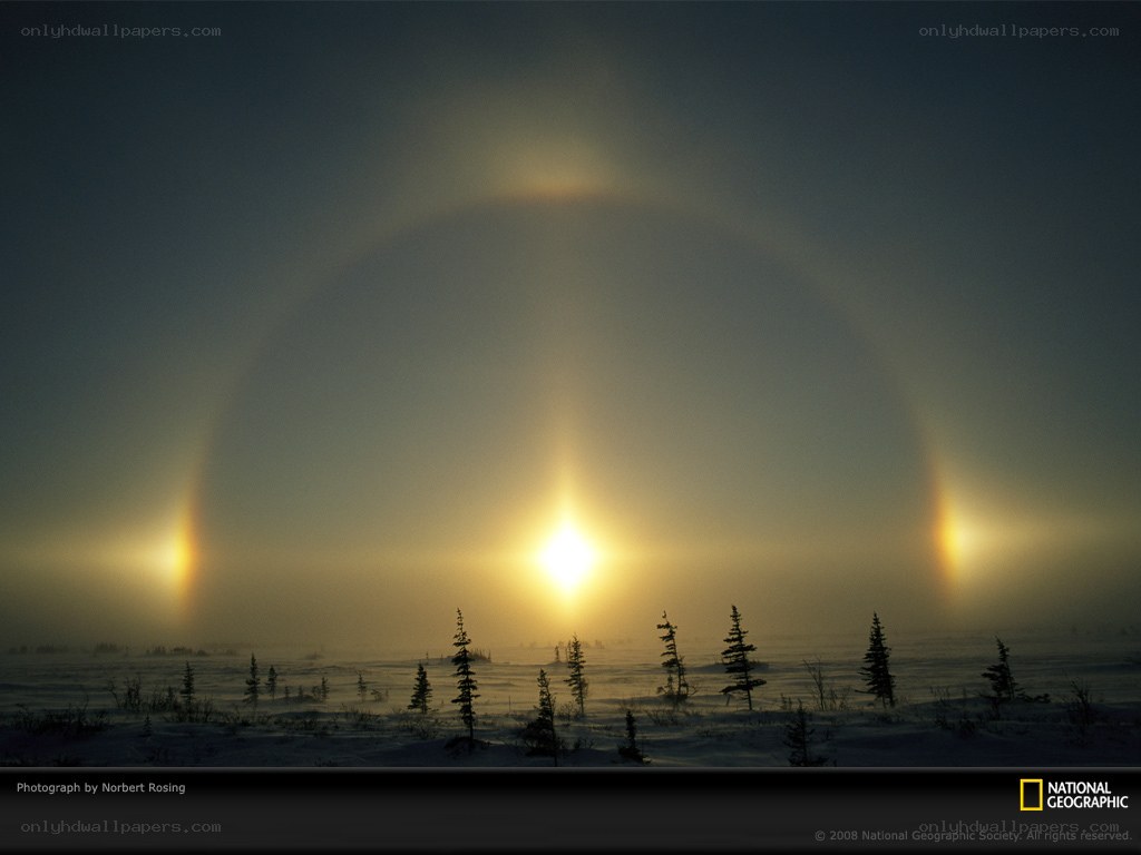 Sun halo over snowy landscape