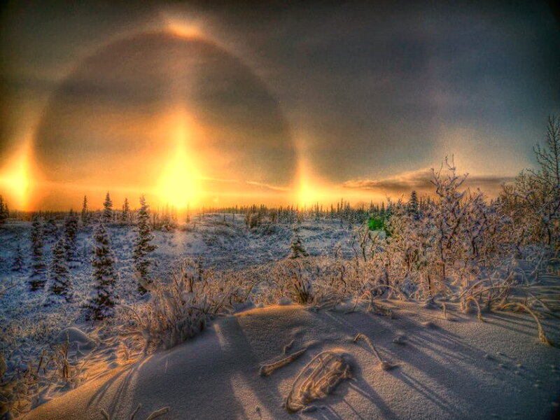 Sun Halo over Snowy Landscape — Orange