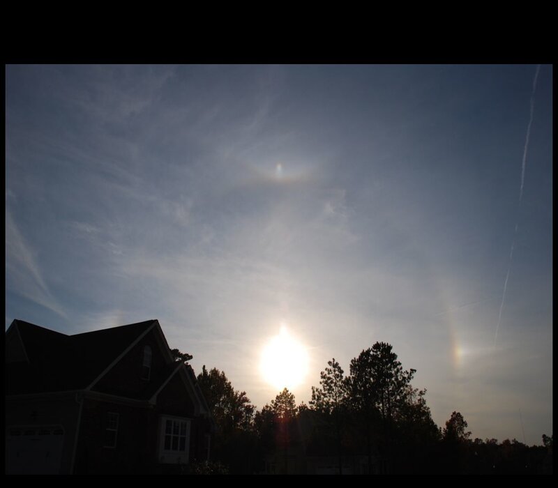 Sun halo over suburban homes