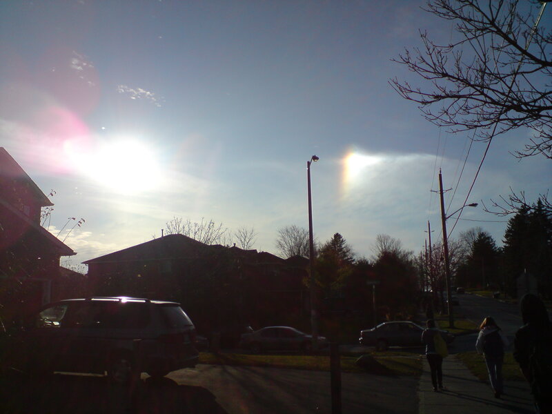 Sun halo over suburban street