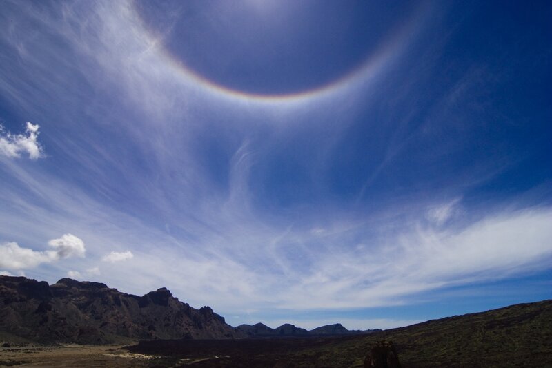Sun halo over volcanic landscape