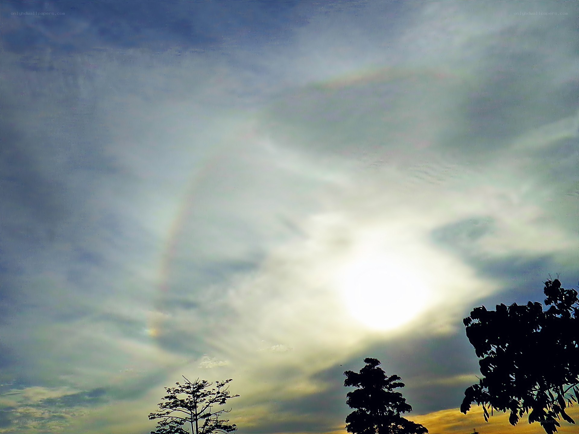 Sun halo with rainbow arc