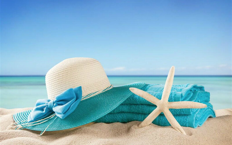 Sun Hat and Towel on Beach — Blue