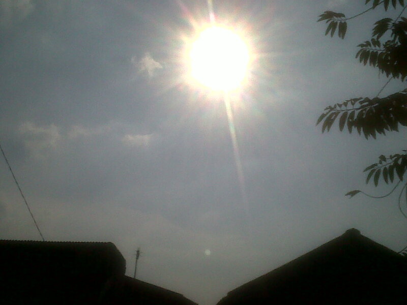 Sun in Cloudy Sky — Gray