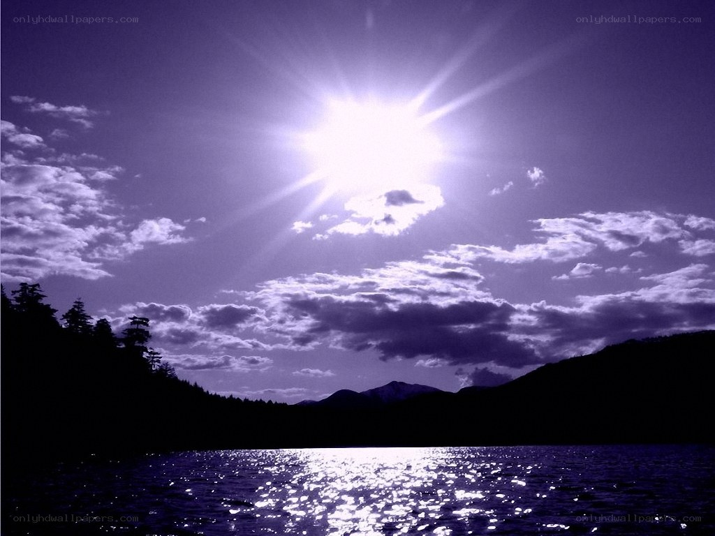 Sun over a purple lake