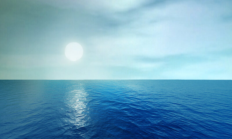 Sun over calm ocean