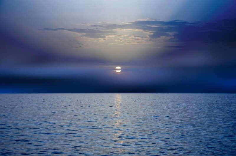 Sun over Calm Water — Blue