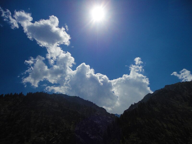 Sun over mountain peaks