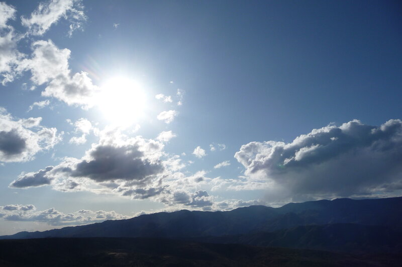 Sun over mountain range