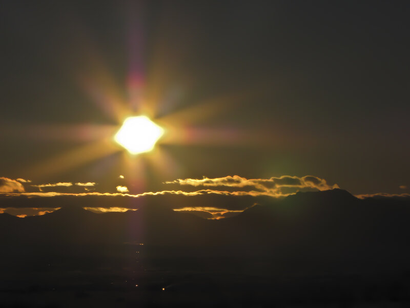 Sun over Mountains