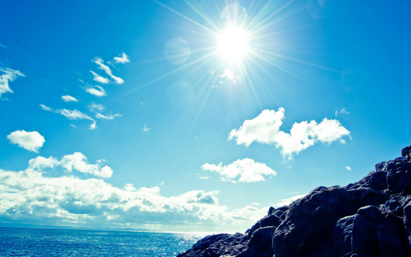 Sun over Ocean and Rocks