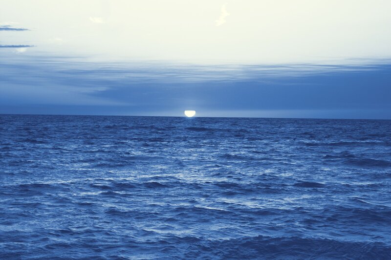 Sun over Ocean — Blue, Serene, Sunset, Photograph, Sky