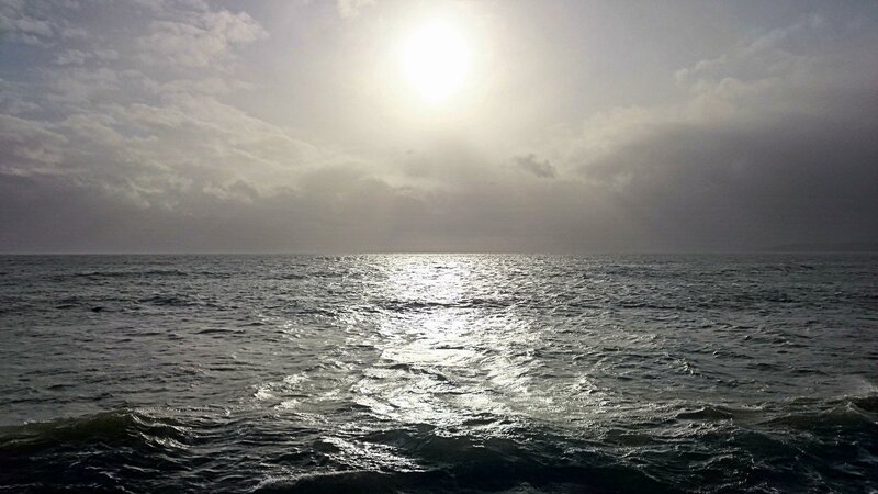 Sun over Ocean — Gray, Dramatic