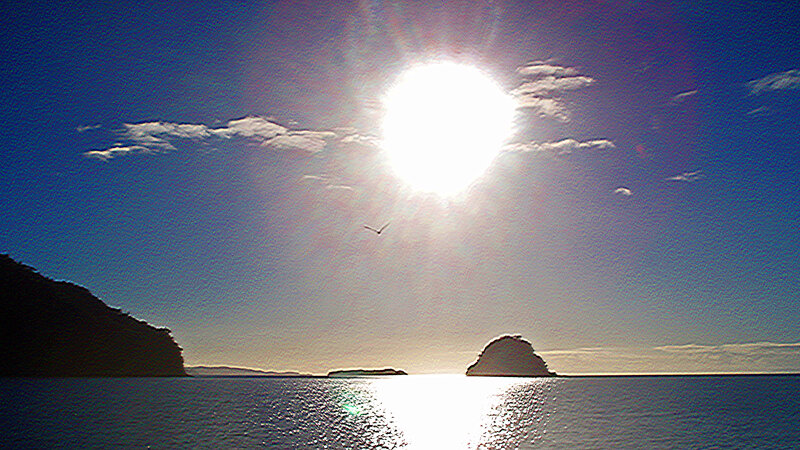 Sun over Sea with Rocks