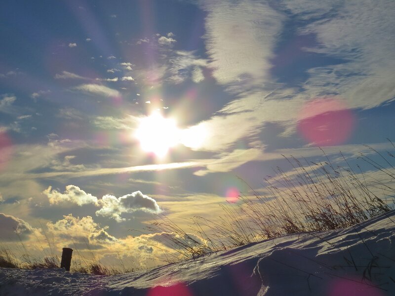 Sun over Snowy Dune