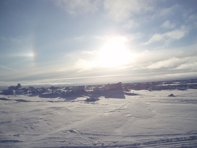 Sun over snowy landscape