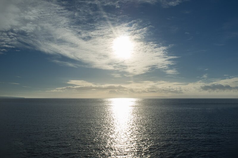 Sun Reflecting on Ocean — Blue