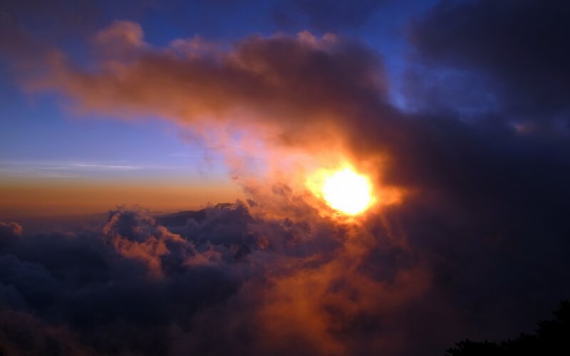 Sun Rising Above Clouds — Orange