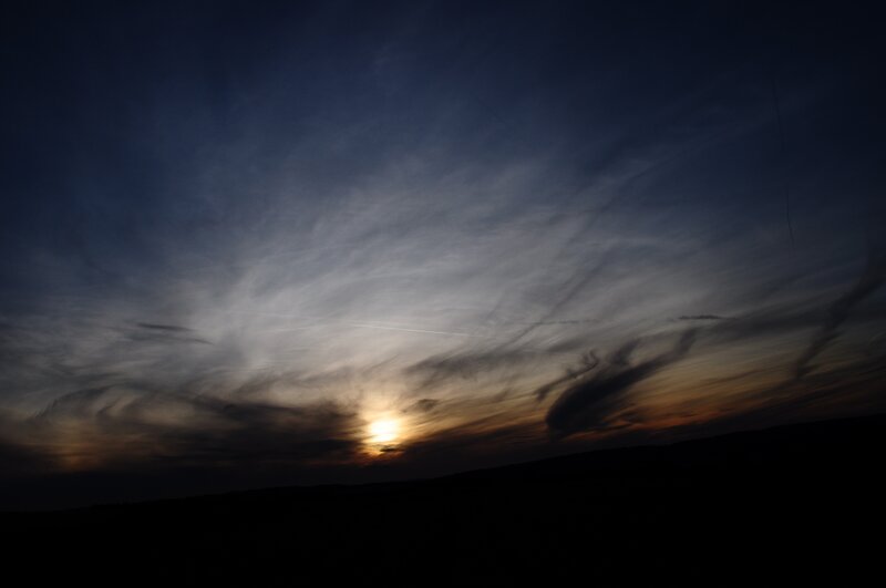 Sun Setting Behind Clouds — Blue, Dramatic, Sunset, Photograph, Sky, Horizon